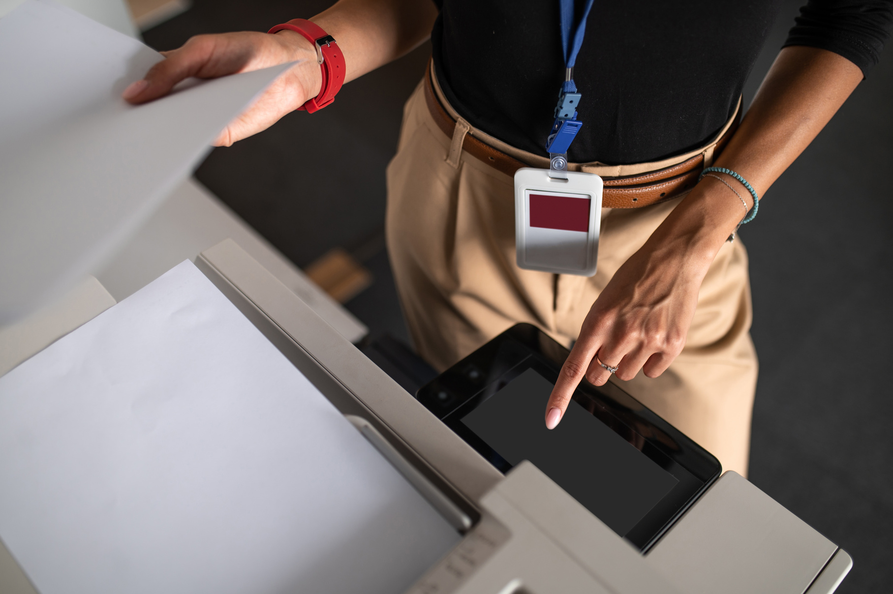 Woman standing near the xerox in the office